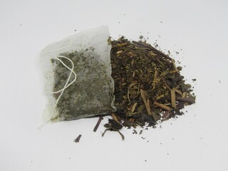 0Loose dried tea leaves with tea bag, concept of traditional and modern beverage, healthy herbal...