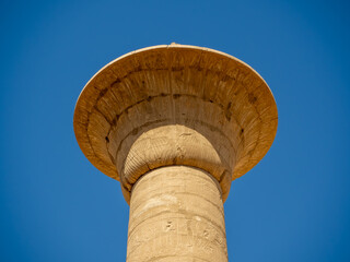 The Great Hypostyle Hall of Karnak Temple, showcasing rows of massive columns intricately decorated with hieroglyphs and reliefs