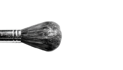 Close-up of a makeup brush, dark gray bristles, and metal ferrule
