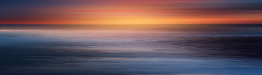 Seascape with neon sunset, ocean waves and rocks.