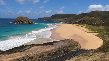 Praia do Leão in Fernando de Noronha, with turquoise sea, golden sand and untouched tropical nature
