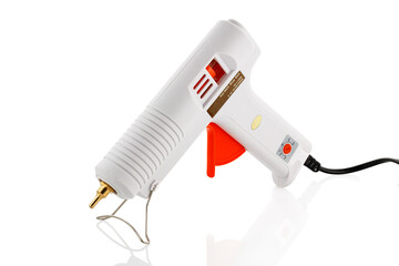 An electric hot glue gun. An hot glue gun isolated on a white background isolated on a white...