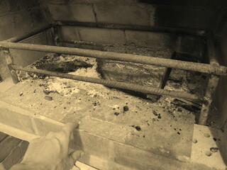 man looking at burnt fire in the oven barbecue meat food