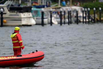 Red inflatable rescue boat with crew during exercise in Flensburg