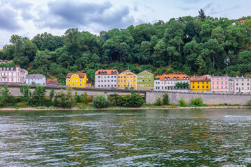 Fototapeta premium Panoramic view of colorful row of houses at river Danube, Passau, Bavaria, Germany. High quality photo