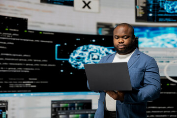 African american professional engineer programming for innovation hub, reviewing big data and...