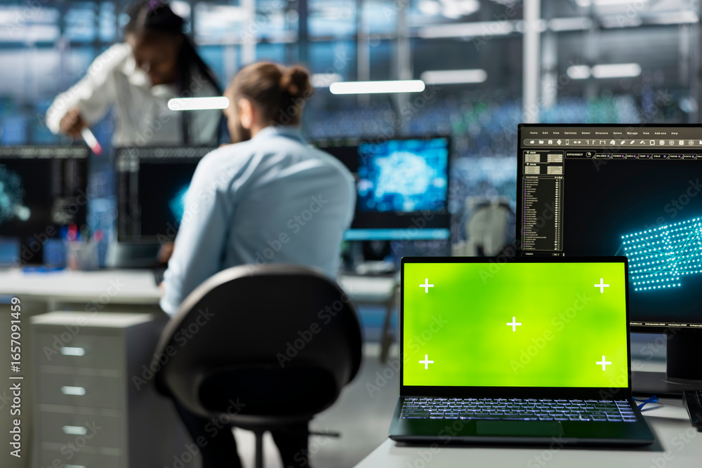 Poster close up of green screen mockup laptop in data center used by engineers doing troubleshooting. chrom
