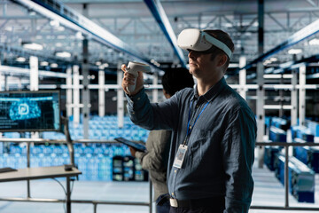 Server room worker simulating data center operations with VR headset and AI tech. Data center engineer using virtual reality technology and artificial intelligence to monitor server rigs