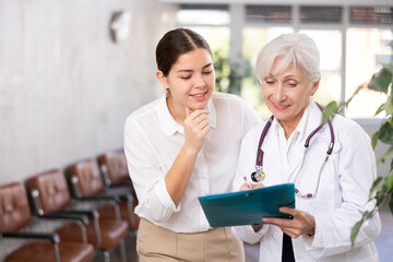 Woman consults with a doctor about the diagnosis and treatment of the disease