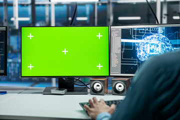 Close up of server room IT specialist using isolated screen PC, deploying deep learning technology. Data center engineer using mockup computer, managing datasets used in neural networks training