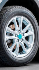 Close-up of a car wheel with metallic finish and textured tire for automotive design and inspiration