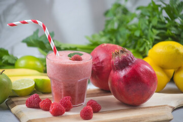 Smoothie with Straw in Glass on Wooden Board