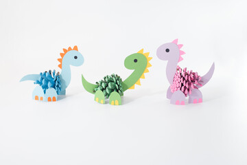 Whimsical pine cone dinosaur craft for children activities, perfect for educational materials, parenting blogs, toy packaging, and eco-conscious marketing campaigns