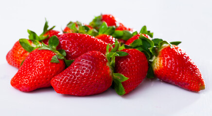 Juicy fresh sweet strawberries close up on isolated white background
