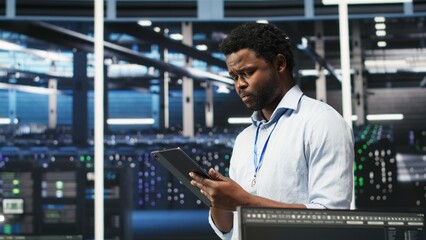 Server farm technician using AI algorithms and node tree systems to categorize unstructured data. Data center worker uses visual programming and natural language processing tools, camera B