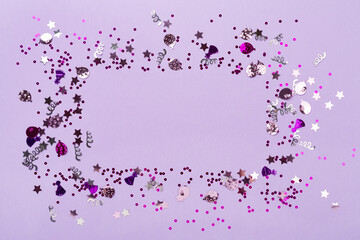 Party pink confetti on color background, top view
