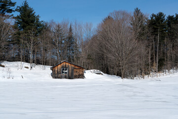 An old shack in a winter landscape