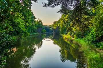 Rakotz Bridge (Rakotzbrucke, Devil's Bridge) in Kromlau, Saxony, Germany. Colorful summer,...
