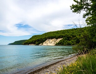 Lakeside cliff face with a sandy beach