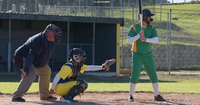 Umpire signaling strike three batter dropping bat racing to first at plate, catcher scooping ball