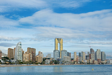 Naklejka premium Benidorm Poniente beach and Mediterranean Sea in sunny day. Benidorm is popular coastal resort town in Alicante province, Spain