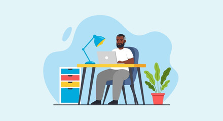 Focused man working on laptop at a vibrant modern desk. Perfect for illustrating remote work, productivity, and contemporary business.