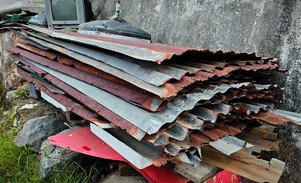 Piles of unused lightweight metal roofing materials to be taken to the factory and recycled into new industrial raw materials.