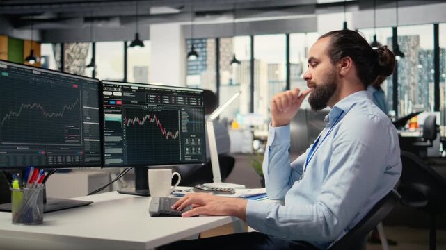 Trader in office closing eyes to do daydreaming, visualizing financial independence and future success. Cheerful prop firm employee at desk lost in thought, picturing prosperous trade, camera A
