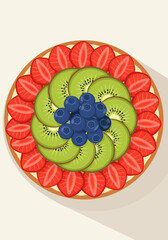A colorful fruit tart with strawberries, kiwi, and blueberries arranged in a circular pattern.