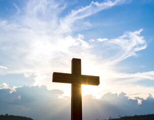 Wooden cross against a vibrant sky at sunset