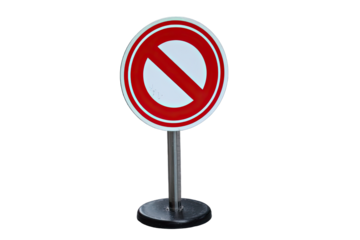 Red circular prohibition sign on a metal stand