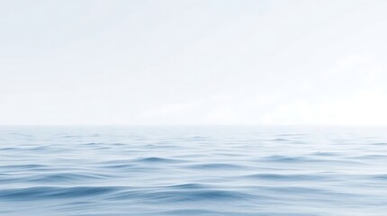 Fototapeta premium Calm ocean waves under a soft, hazy sky, creating a serene and tranquil atmosphere perfect for relaxation and mindfulness.