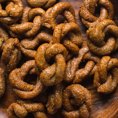 Fototapeta premium Overhead view of alkaki northern nigerian snack, Hausa doughnut made with wheat and sugar paste or honey