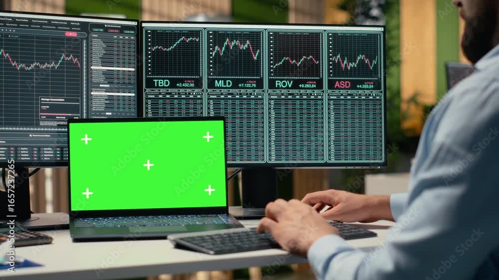 Poster day trader in brokerage office analyzes stock market charts on isolated screen laptop, making buy an