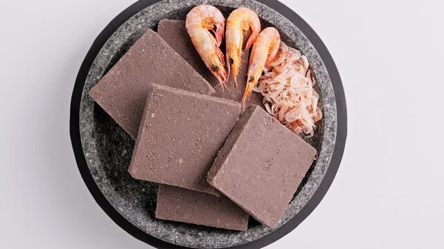 Traditional Indonesian Shrimp Paste Terasi on mortar stone