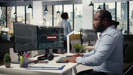 Trader frightened by security alert on PC after hacker uses exploit to penetrate systems. Brokerage company worker responds to cyberattack, protecting client account from unauthorized access, camera A - Powered by Adobe