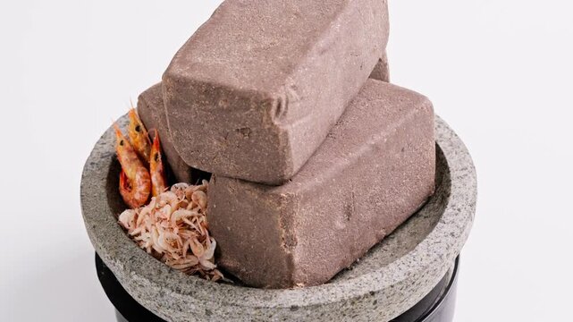 Traditional Indonesian Shrimp Paste Terasi on mortar stone