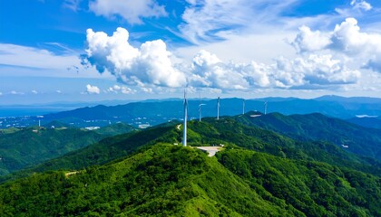 Scenic vista of wind turbines atop a lush mountain range.