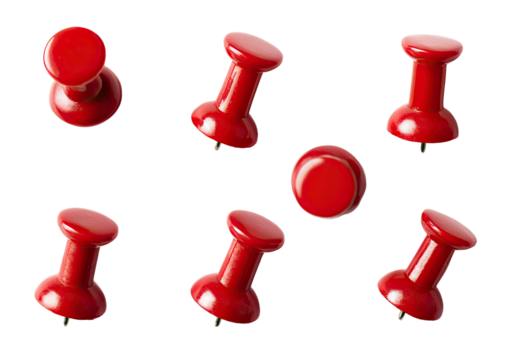 Red pushpins arranged on black background