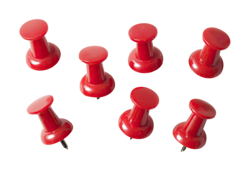 Eight bright red push pins arranged randomly on a black background