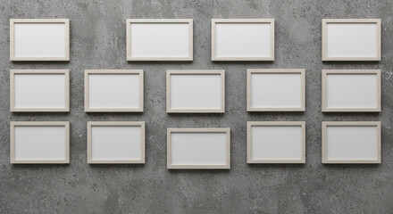 Clean gallery wall featuring multiple empty light wood photo frames mounted on textured concrete