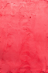 Top view of red buttercream for decorating cake, silky smooth american buttercream with patterns, overhead view of smooth red buttercream