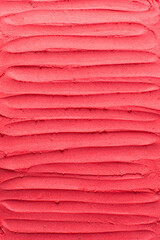 Top view of red buttercream for decorating cake, silky smooth american buttercream with patterns, overhead view of smooth red buttercream