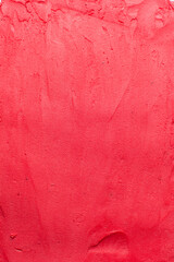 Top view of red buttercream for decorating cake, silky smooth american buttercream with patterns, overhead view of smooth red buttercream