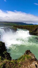 Fototapeta premium Waterfall cascading over rocks