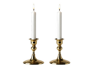 Two gold candle holders with white candles