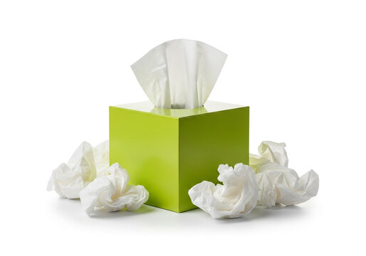 Green tissue box with used tissues scattered around it on white background