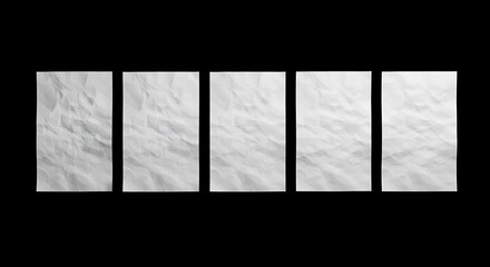 Five Crumpled White Papers on Black Background