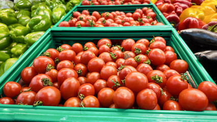 Fresh tomatoes displayed at the market for sale