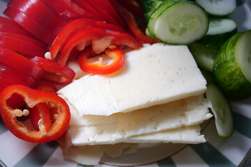 Fresh vegetables and cheese preparation for a salad